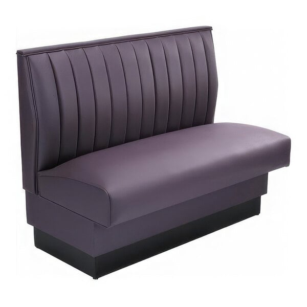 A purple upholstered booth seat with vertical channel stitching on the backrest and a solid base.
