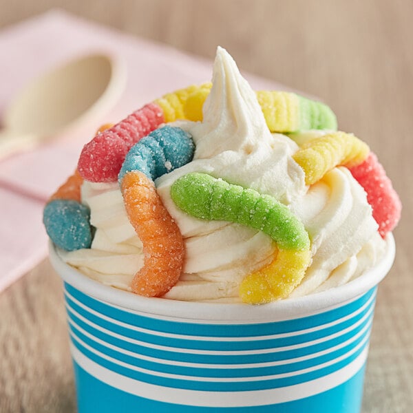 A cup of ice cream topped with Albanese Mini Gummi Worms.