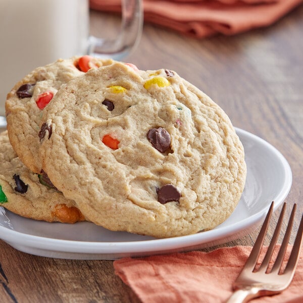 A plate of David's Cookies M&M's chocolate chip cookies with candy on it.