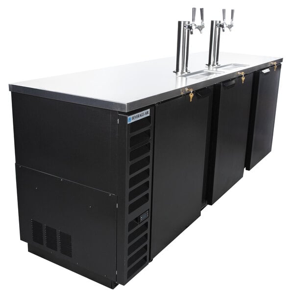 A black Beverage-Air wine dispenser with two taps on a counter.