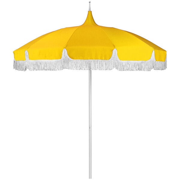 A California Umbrella sunflower yellow round umbrella with white fringe on top.