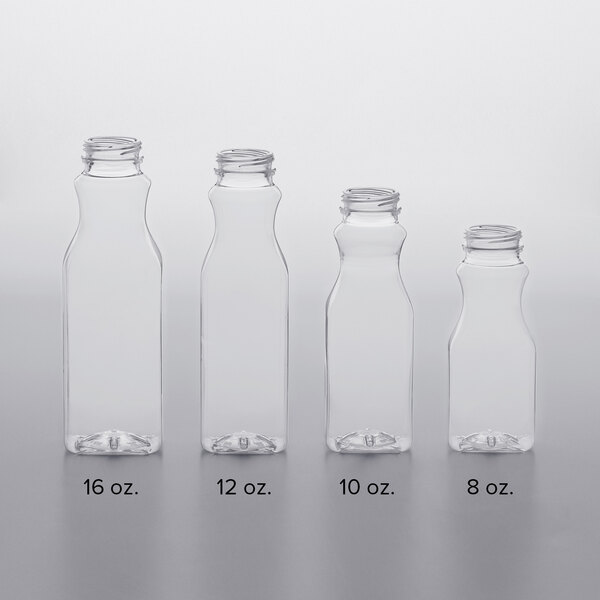 A row of white PET clear square juice bottles with black lids.