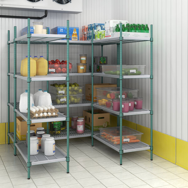 A Regency green wire shelving unit in a pantry filled with food.