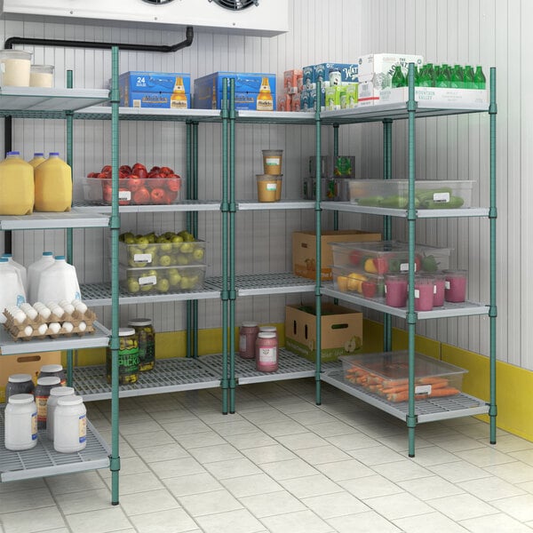 A Regency green wire shelving unit in a pantry filled with food items.