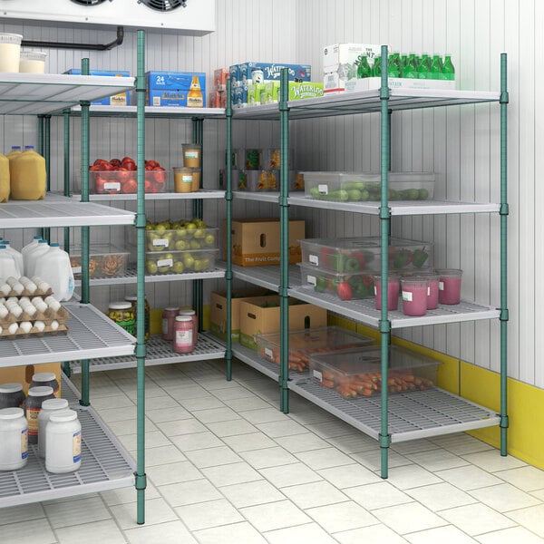 A room with Regency green wire shelving filled with food and other items.