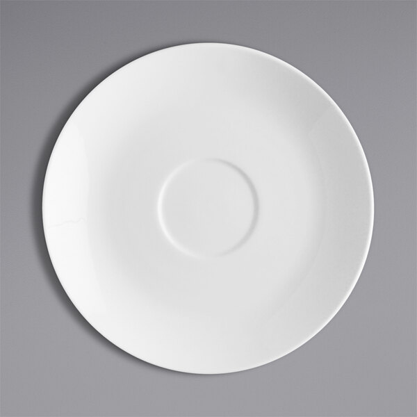 A Fortessa Caldera bright white china saucer with a white circle on a gray background.