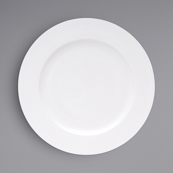 A Fortessa Ilona white china plate with a wide white rim.