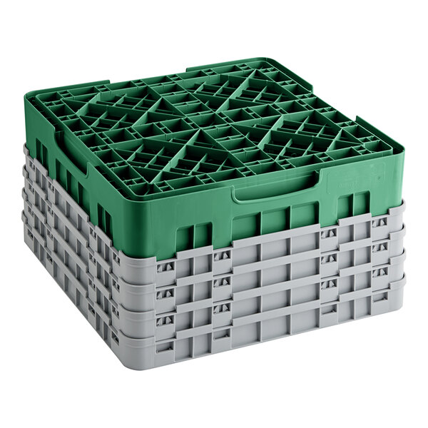 A green plastic Cambro glass rack with extenders.