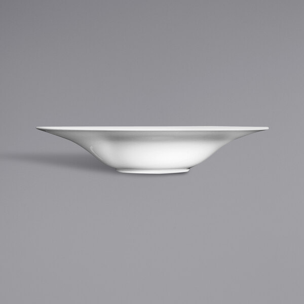 A white Fortessa Ilona china pasta bowl on a grey background.