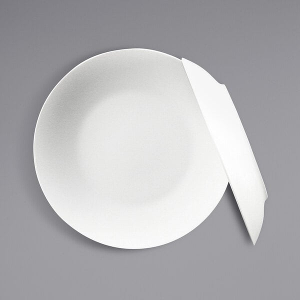 A close-up of a white Fortessa Ilona coupe bowl.