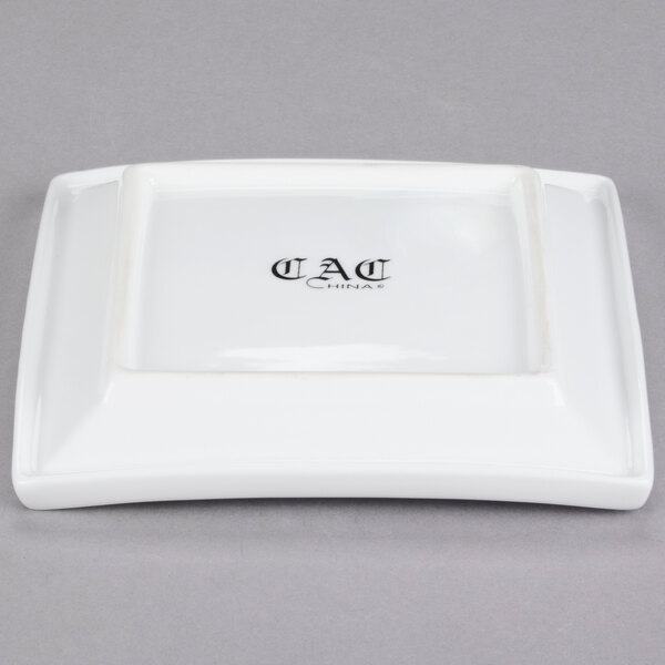 A white square porcelain plate with black text that reads "TOK-6" in the corner.