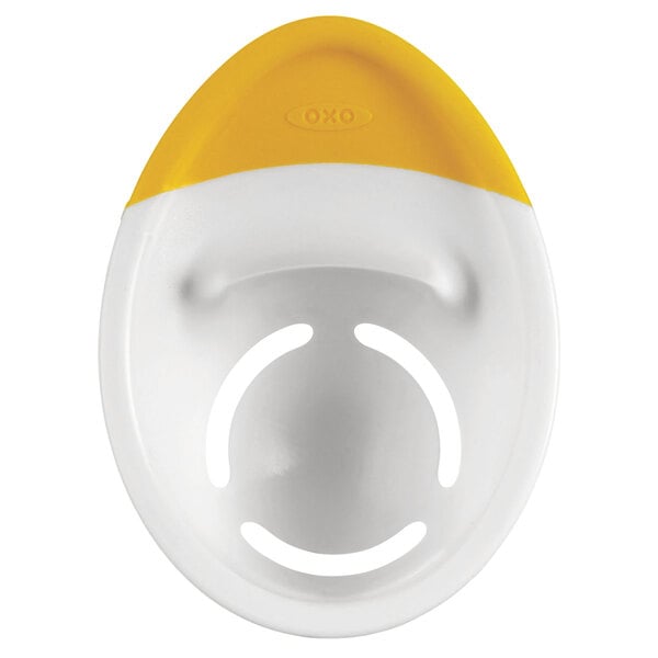 An OXO white and yellow plastic egg separator.