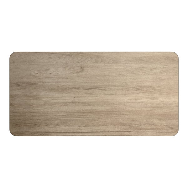 A rectangular reversible laminated table top with a white birch and ash wood finish.