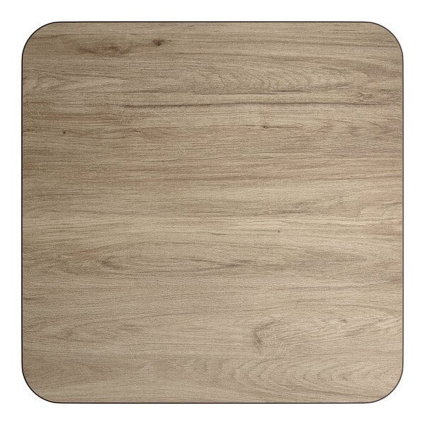A square, reversible laminated table top with a white birch and ash wood grain finish.