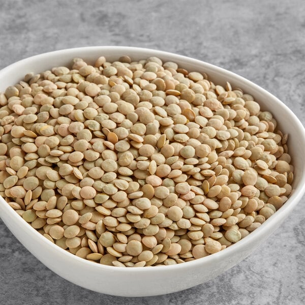 A bowl of Goya lentils on a table.