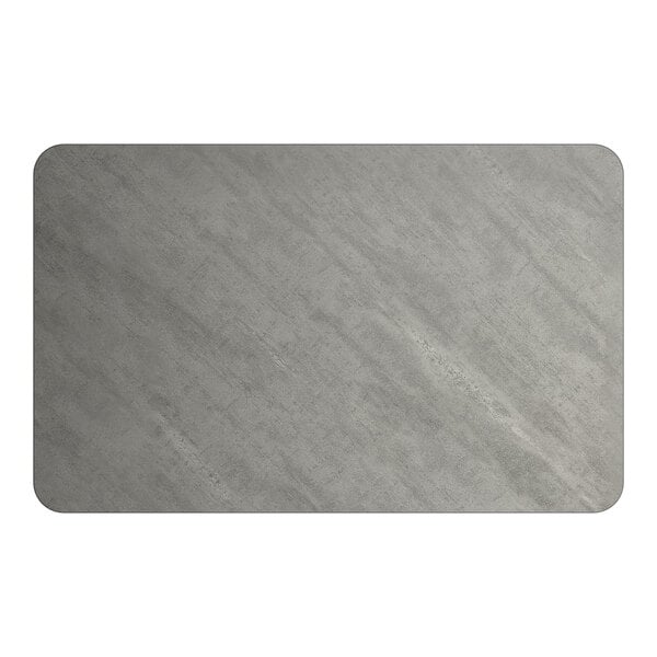 A rectangular, reversible laminated table top with a gray slate finish.