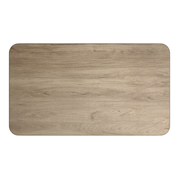 A rectangular reversible laminated table top with a white birch and ash wood finish.
