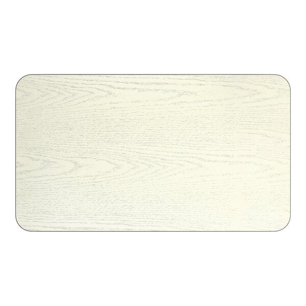A rectangular reversible laminated table top with a white birch and ash wood grain finish.