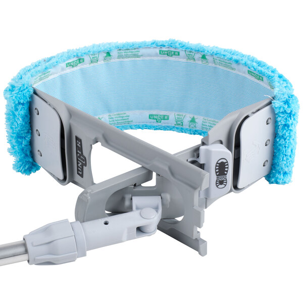 A Unger SmartColor EZ Flat Mop Holder with a blue and green mop head attached.