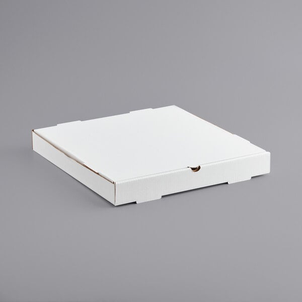 A white bakery box on a gray surface.