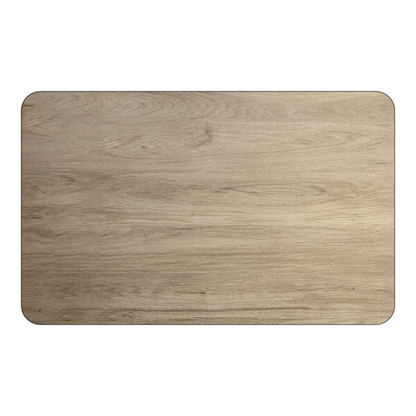 A rectangular reversible laminated table top with a white birch and ash wood finish.
