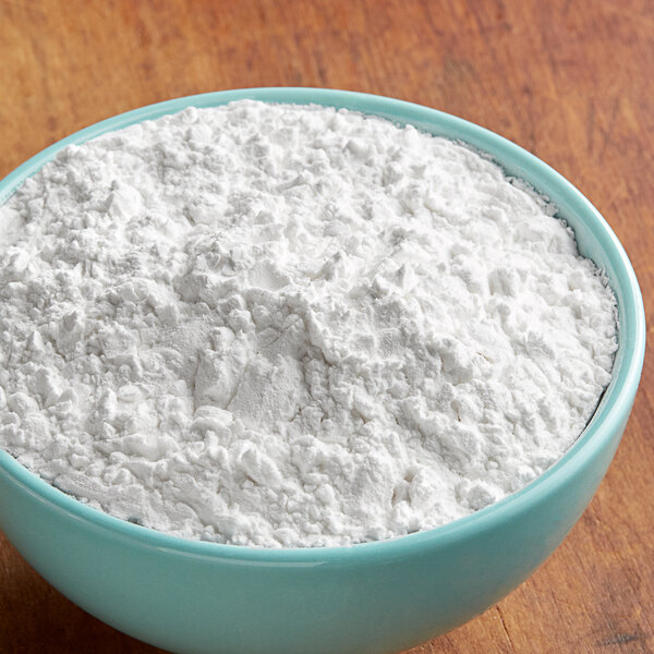 A bowl of Goya Yuca Harina Tapioca Starch on a wood surface.