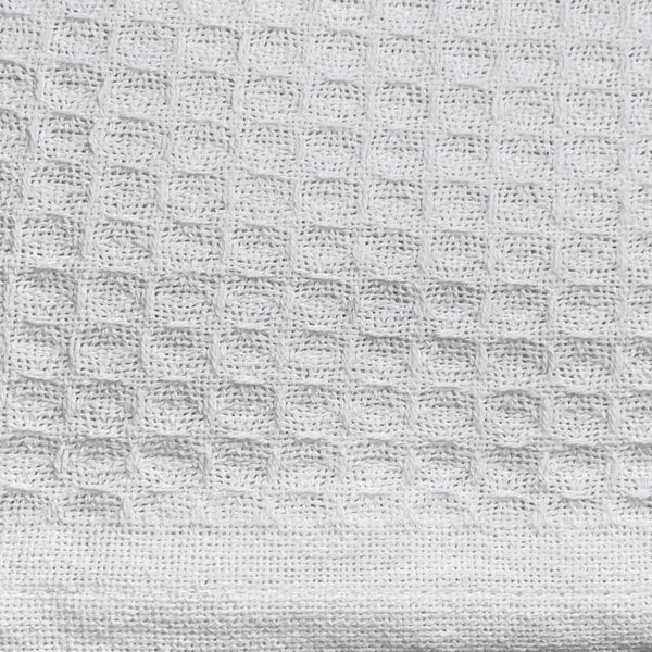a close up of a white knitted fabric