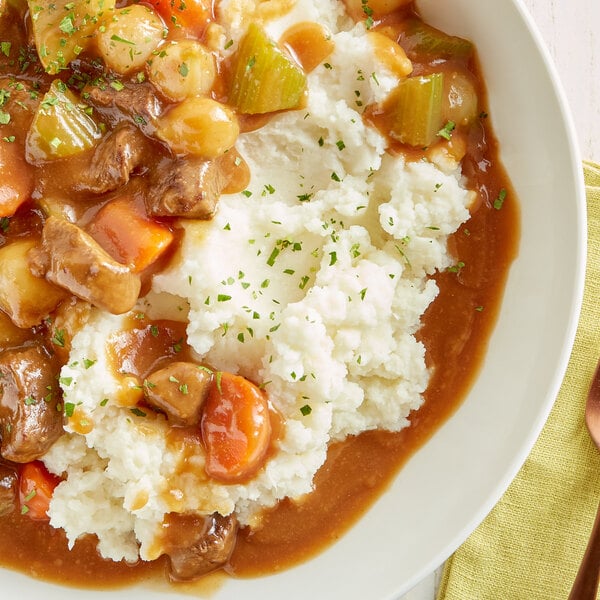 A bowl of Idahoan mashed potatoes with meat.