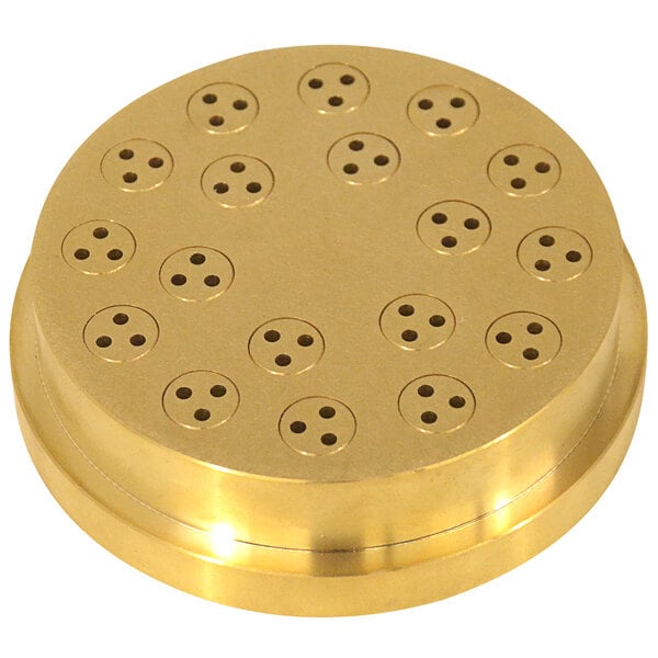 A circular brass disc with holes in it.