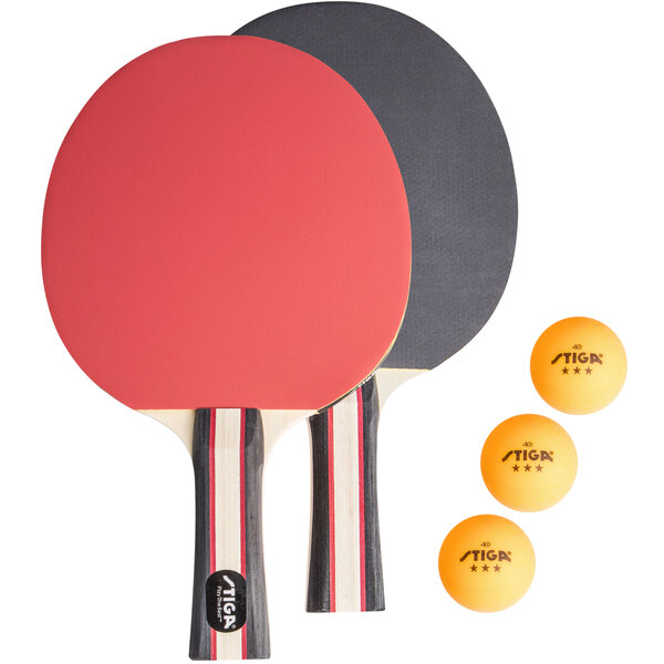 A Stiga ping pong paddle set with two paddles and balls.