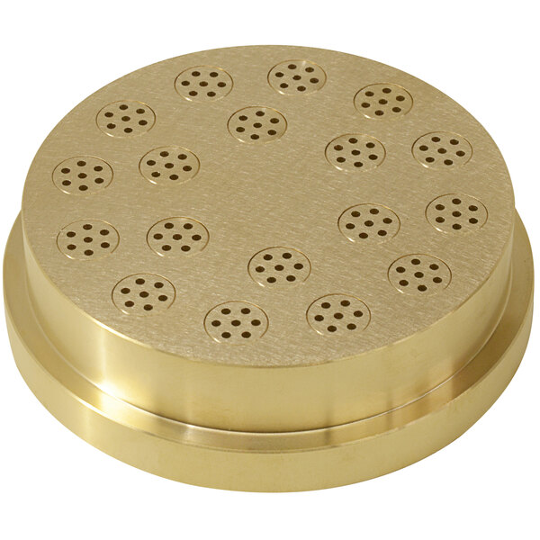 a circular gold object with holes