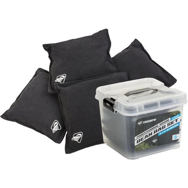 a group of black pillows next to a clear container