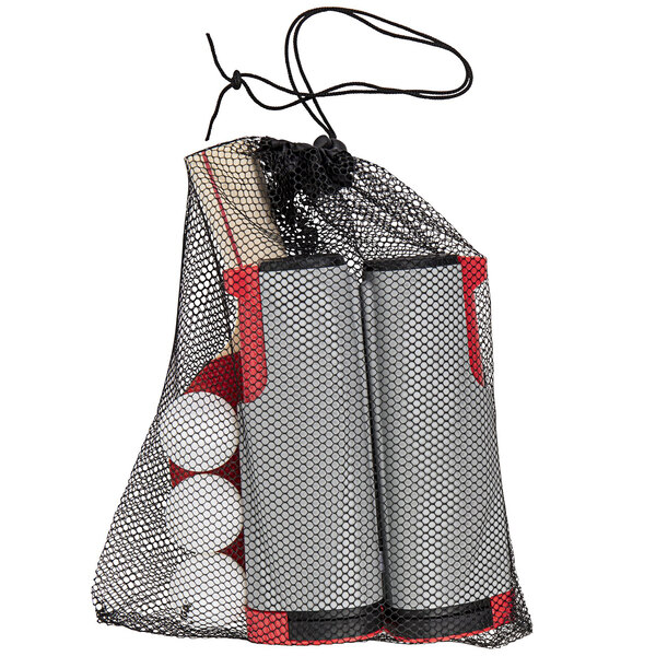 A Stiga net bag with balls and a ping pong paddle inside.
