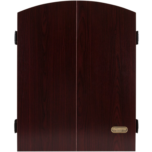 An Arachnid Bullshooter Marauder 5.0 dartboard cabinet with wood doors.