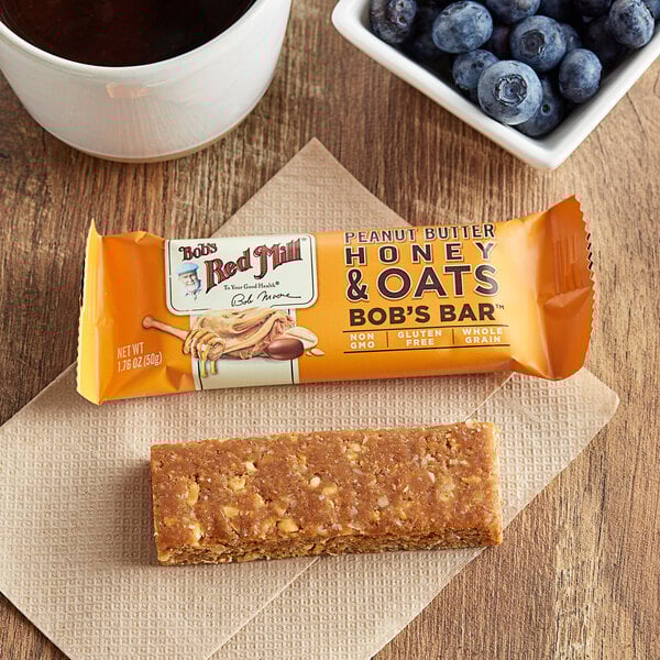 A close up of a Bob's Red Mill Peanut Butter Honey & Oats Bar.