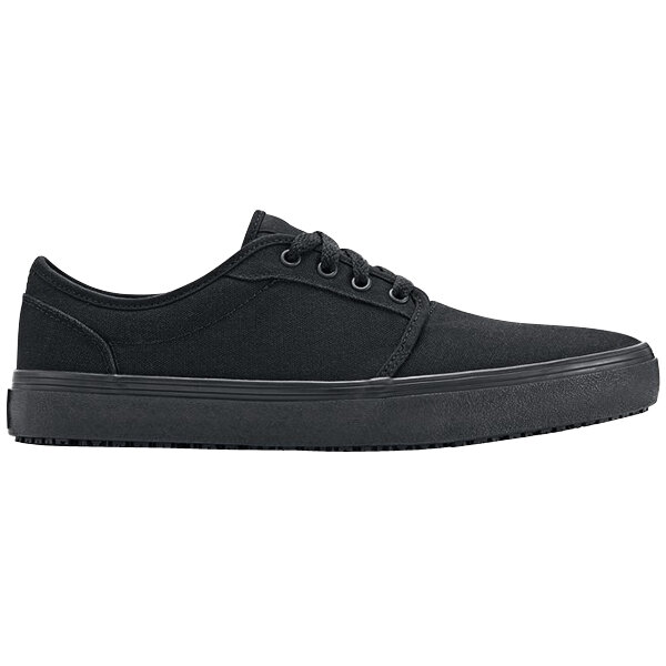 A black Shoes For Crews Merlin unisex shoe with laces and a rubber sole.