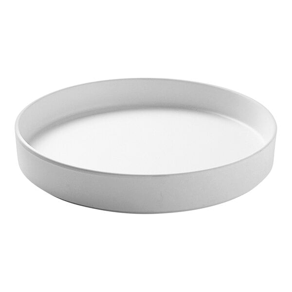 A white round Cal-Mil Hudson melamine plate with a raised rim on a white surface.