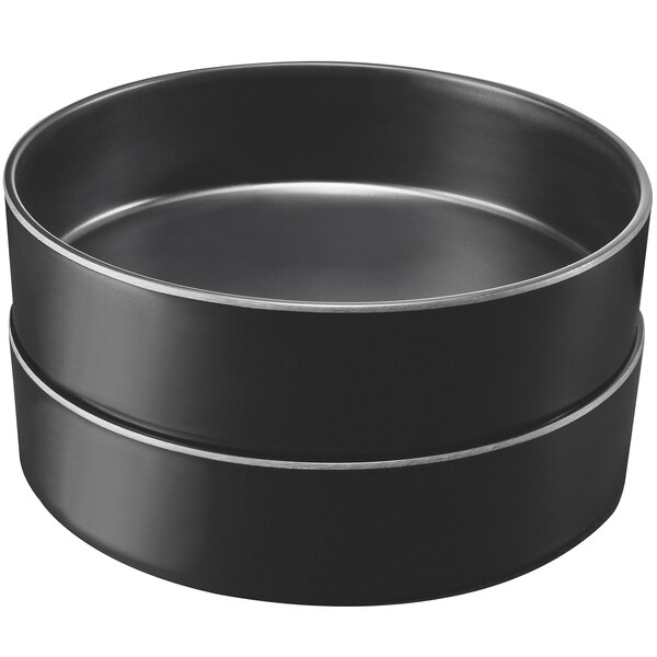 A stack of black Cal-Mil Hudson melamine bowls with silver rims.