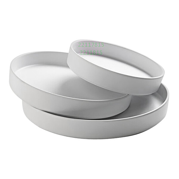 A stack of three white Cal-Mil Hudson melamine bowls.