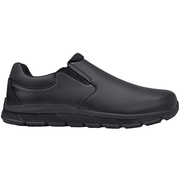 A pair of black Shoes for Crews slip-on shoes with a rubber sole.