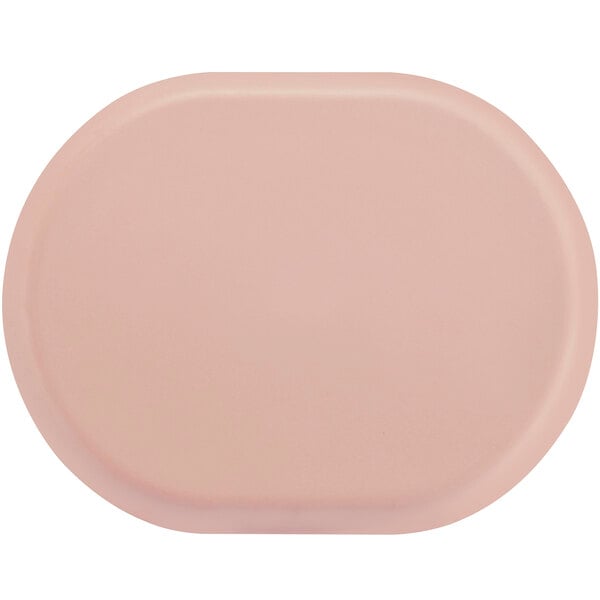 A blush pink oval melamine platter with raised rims.