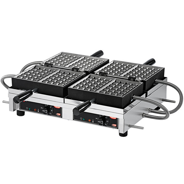 A close up of a Hatco Brussels style double Belgian waffle maker with four square plates.