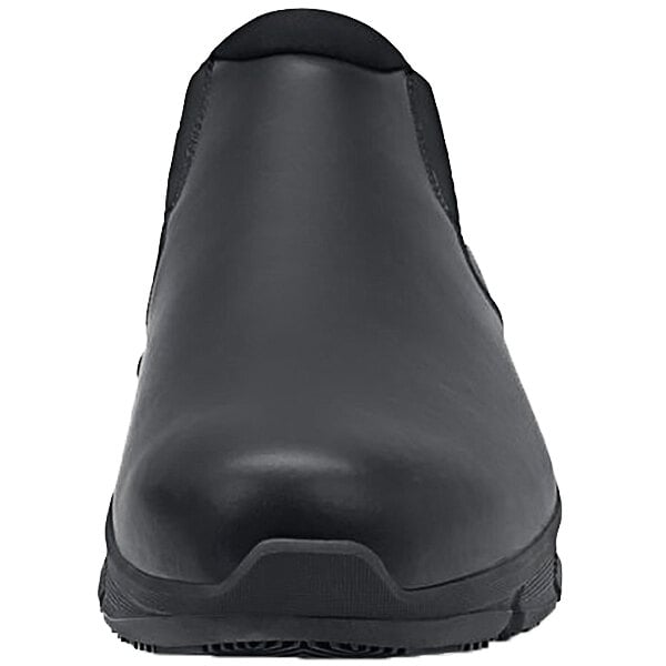 A black Shoes for Crews Cater II unisex slip-on shoe with a rubber sole.
