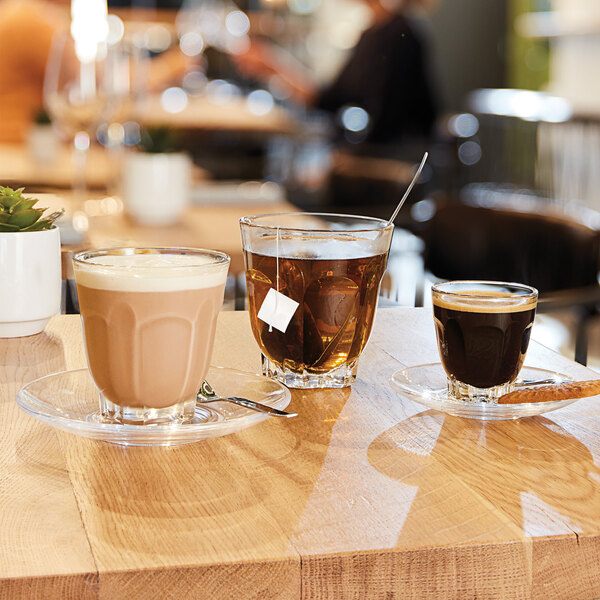 Arcoroc Q2234 Arcadie Rocks glass with brown liquid on a table