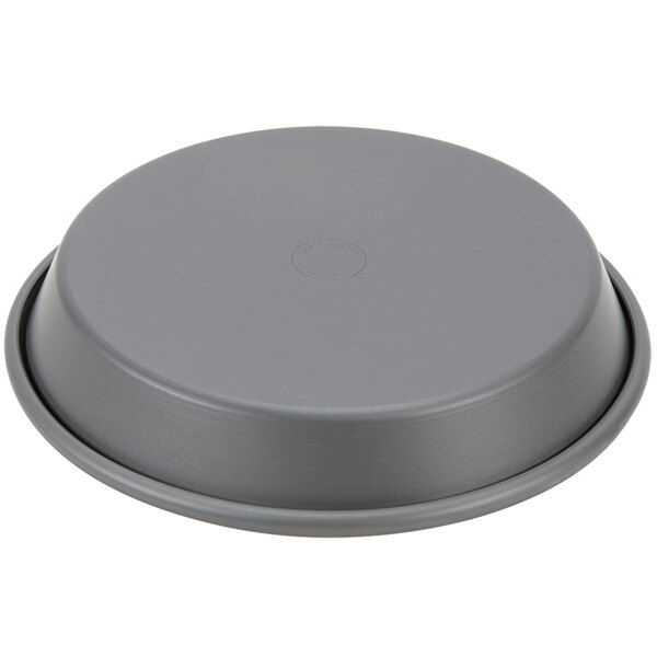 An American Metalcraft hard coat anodized aluminum deep dish pizza pan with a round shape and tapered sides.