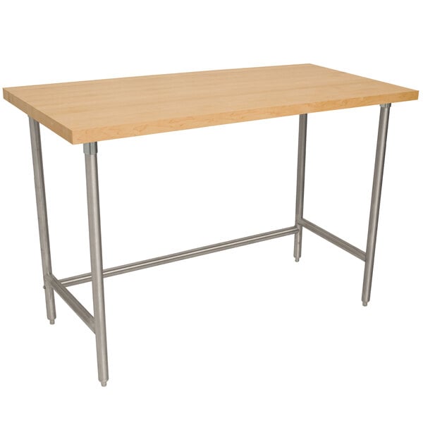 An Advance Tabco wood top work table with a stainless steel base.