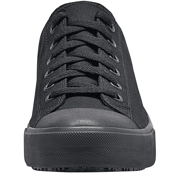 A close up of a black Shoes For Crews Delray non-slip shoe with laces.