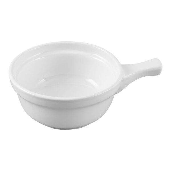 A white china French casserole bowl with a handle.