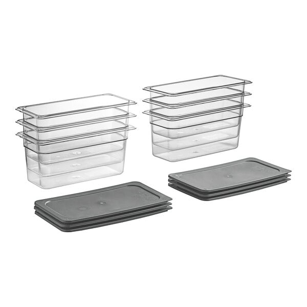 A stack of Vigor clear plastic food pans with secure sealing covers.