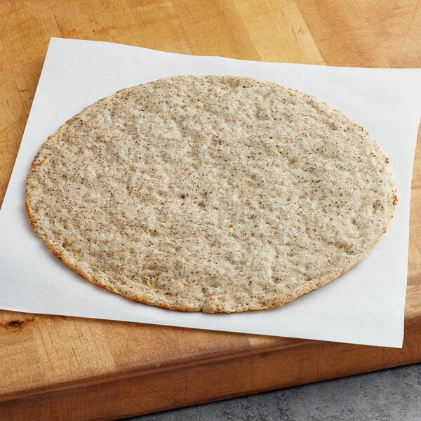 A Rich's vegan cauliflower pizza crust on a piece of paper.